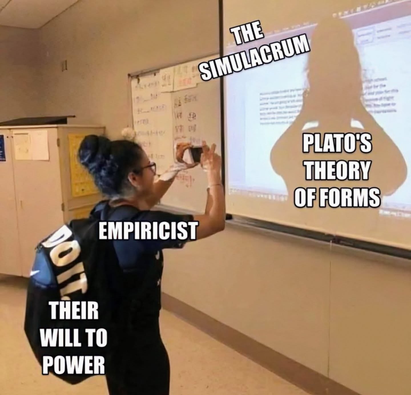 The meme depicts a person in a classroom, looking at a whiteboard with a diagram of the ancient Greek philosopher Plato's Theory of Forms. The image is captioned with the phrase "I can explain the difference between a Platonic ideal and a simulacrum in 10 minutes" and a humorous, sarcastic tone is implied.